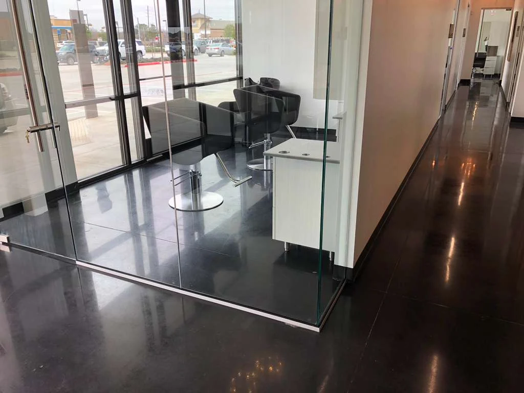 Glossy dark epoxy floor in a dining area
