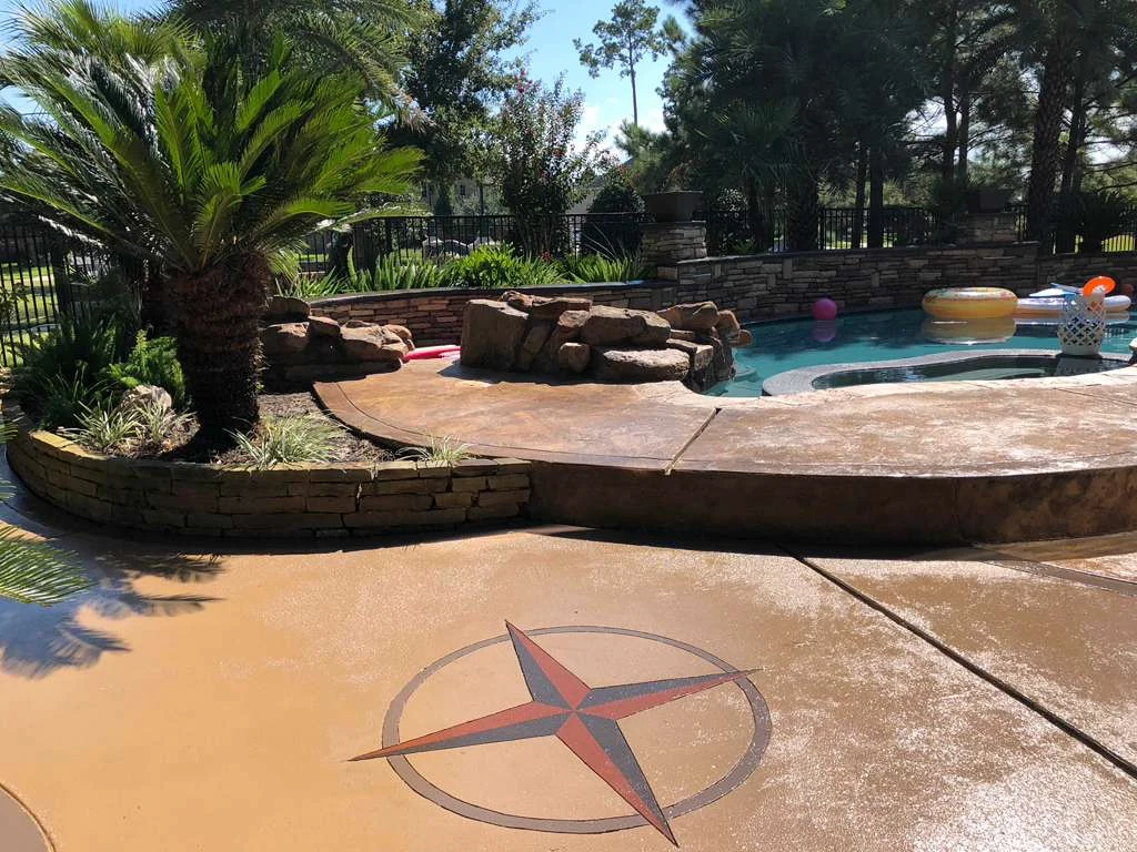 Concrete pool deck with a compass design