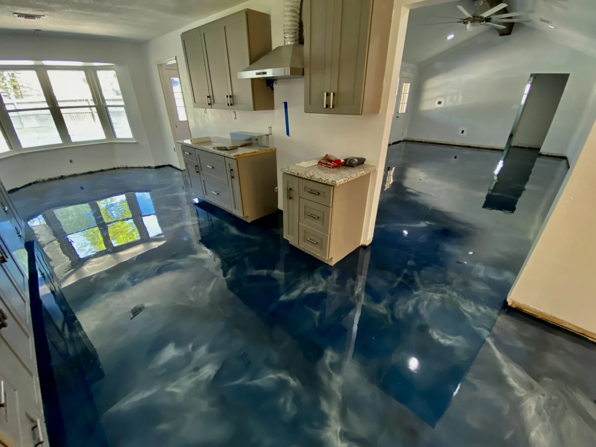 Blue metallic epoxy floor in a kitchen