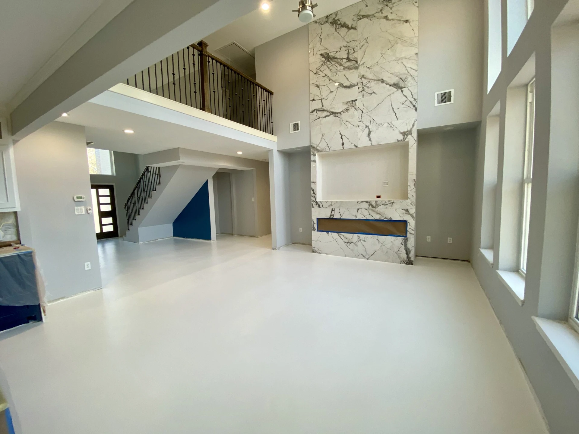 Seamless white epoxy floor in a bright home